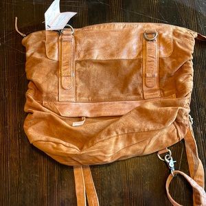 Free People Iris Convertible Backpack in brown.
